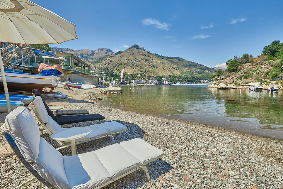 The private beach below the house